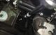 Swivel socket on an extension reaching the E30 control arm center ball joint nut from the top